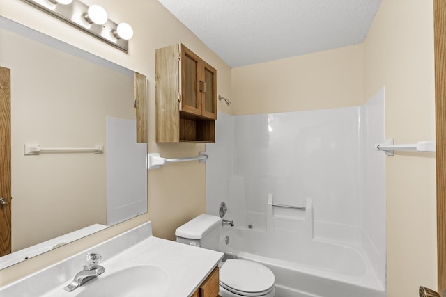 full bath featuring toilet, shower / tub combination, a textured ceiling, and vanity