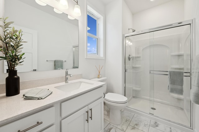 full bath featuring toilet, marble finish floor, a shower stall, and vanity