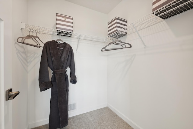 walk in closet featuring carpet and visible vents