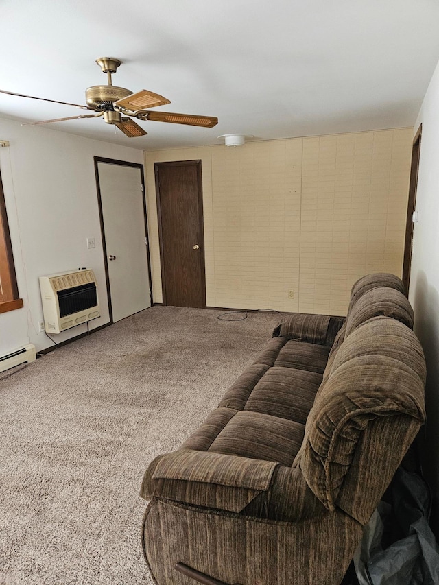 living room featuring baseboard heating, heating unit, a ceiling fan, and carpet floors