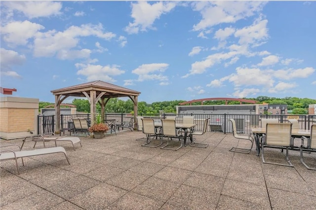 view of patio with a gazebo and fence