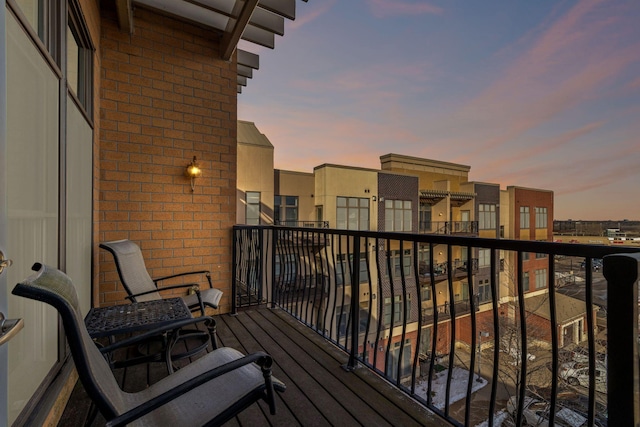 view of balcony at dusk