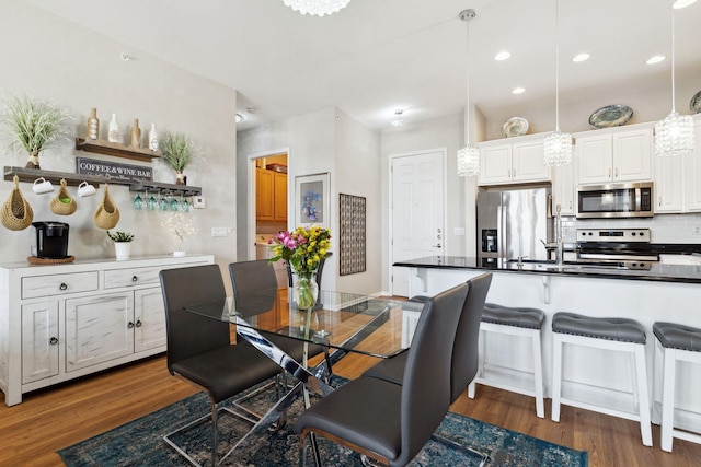 dining room featuring recessed lighting and dark wood-style flooring