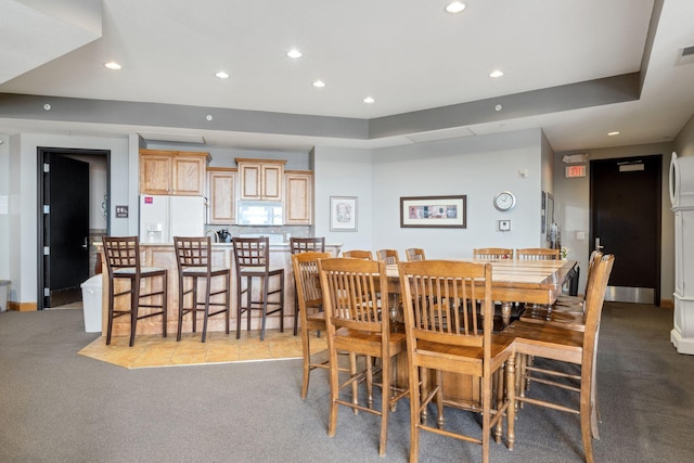 dining space with light carpet, recessed lighting, and baseboards