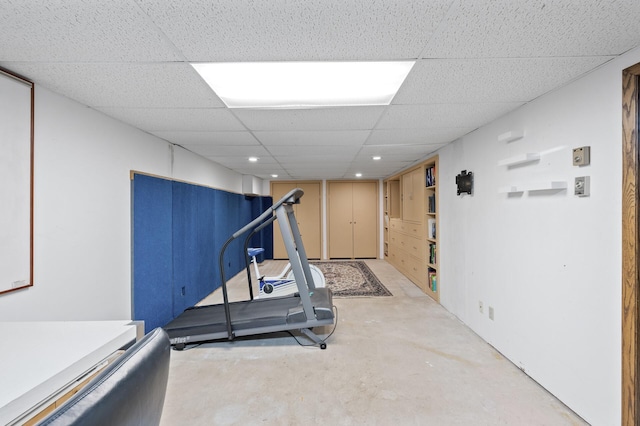 exercise room with a drop ceiling