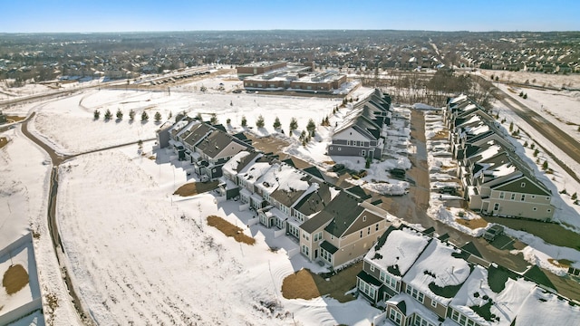 snowy aerial view featuring a residential view