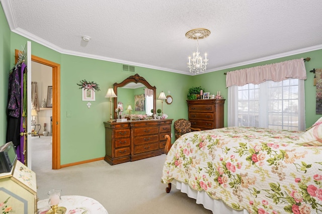 bedroom featuring visible vents, a notable chandelier, a textured ceiling, carpet floors, and crown molding