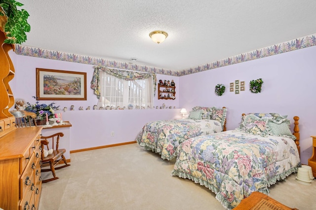 carpeted bedroom with a textured ceiling and baseboards