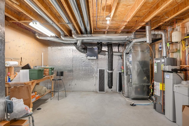 unfinished basement featuring heating unit and water heater