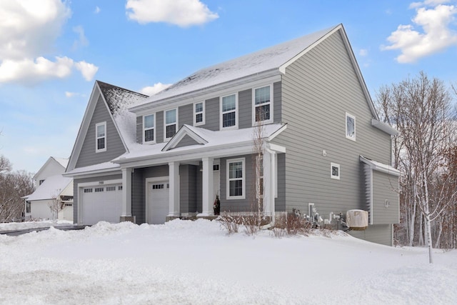 view of front of house with a porch and an attached garage