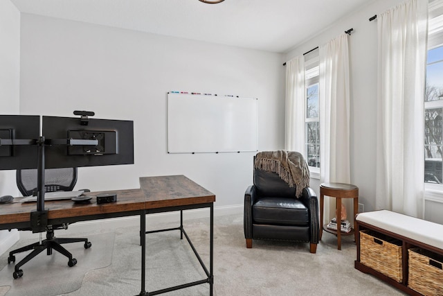 home office with carpet flooring, a healthy amount of sunlight, and baseboards