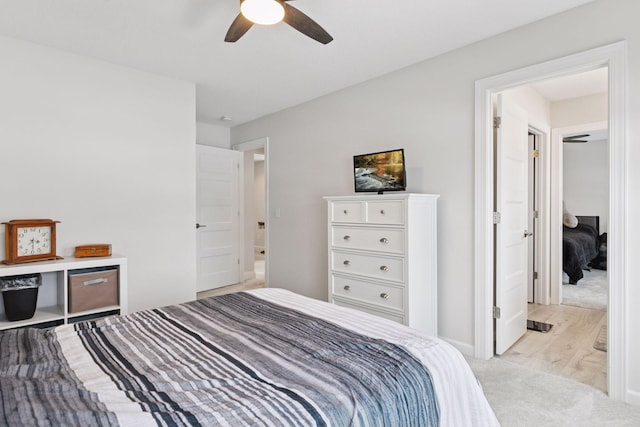 bedroom with ceiling fan and light carpet