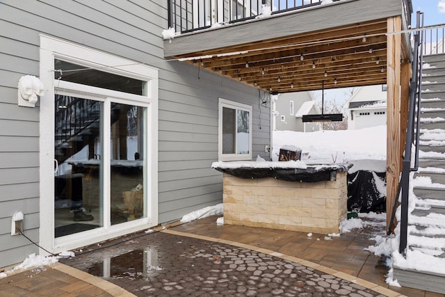 view of snow covered patio