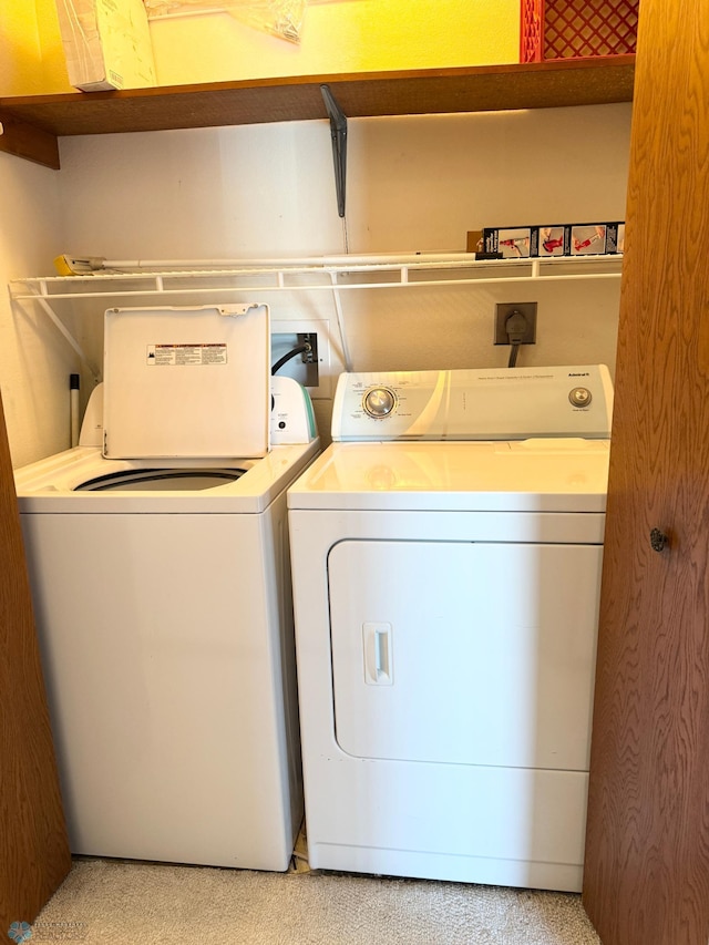 washroom featuring laundry area and separate washer and dryer