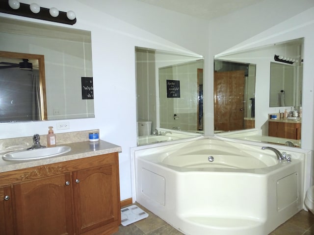 full bathroom with a garden tub and vanity