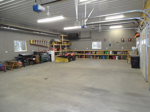 garage featuring a workshop area and a garage door opener