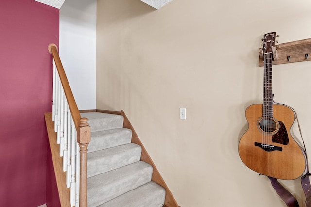 stairway featuring baseboards