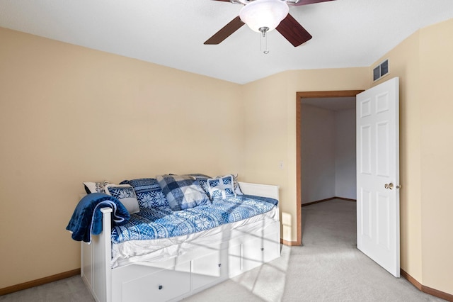 bedroom with baseboards, visible vents, a ceiling fan, and light colored carpet