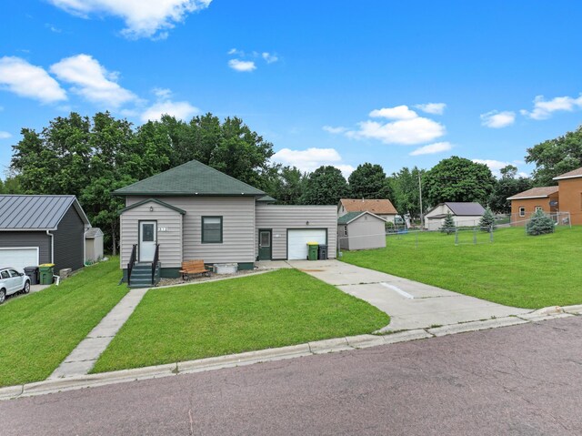 312 4th St E, Jasper, MN 56144 - view of front of house with entry steps, concrete driveway, a garage, and roof with shingles