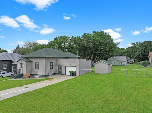 312 4th St E, Jasper, MN 56144 - rear view of house with concrete driveway, roof with shingles, and an attached garage