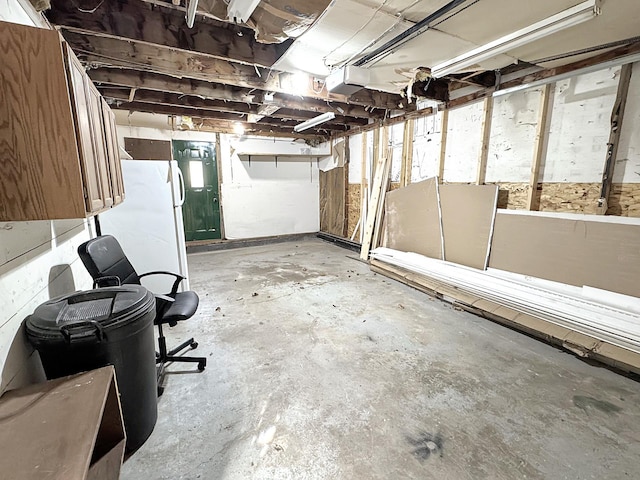 312 4th St E, Jasper, MN 56144 - unfinished basement featuring freestanding refrigerator