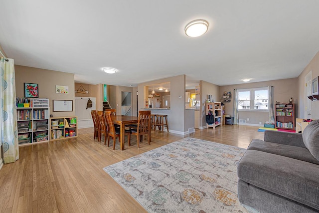 living area featuring wood finished floors and baseboards