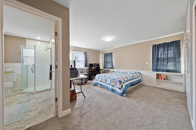 carpeted bedroom featuring connected bathroom