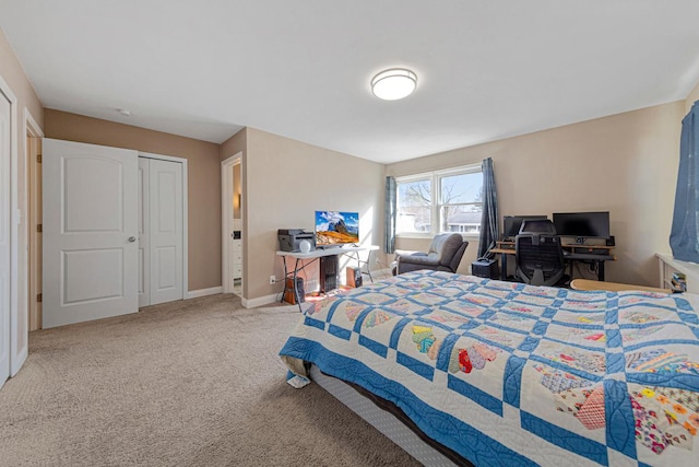 bedroom with carpet and baseboards