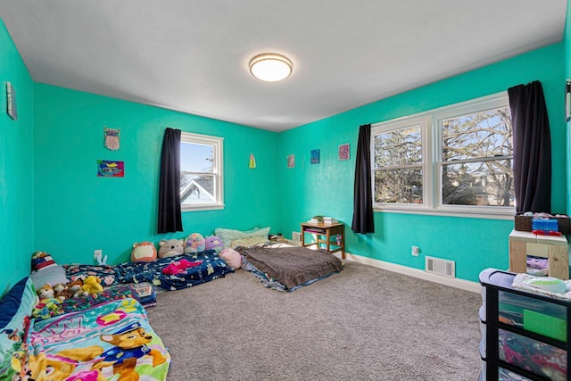 playroom featuring baseboards, plenty of natural light, visible vents, and carpet flooring