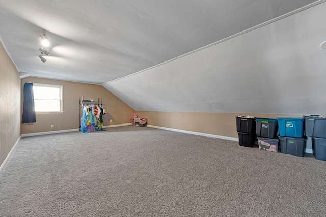 game room with vaulted ceiling, carpet floors, and baseboards