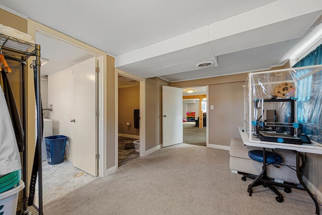 office space with carpet floors, baseboards, and visible vents