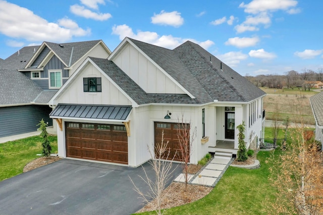 modern farmhouse with roof with shingles, board and batten siding, a standing seam roof, metal roof, and driveway