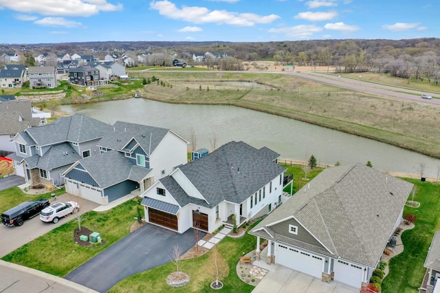 aerial view with a residential view and a water view