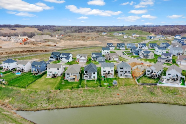 birds eye view of property featuring a water view and a residential view