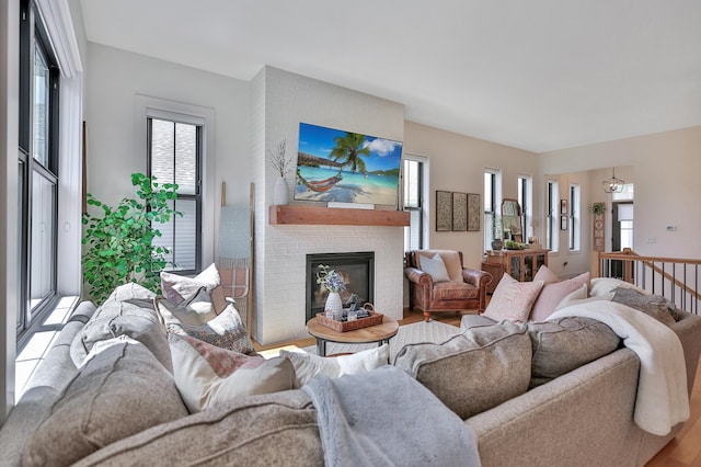 living area with a fireplace and wood finished floors