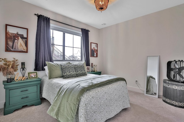 bedroom featuring carpet floors and baseboards