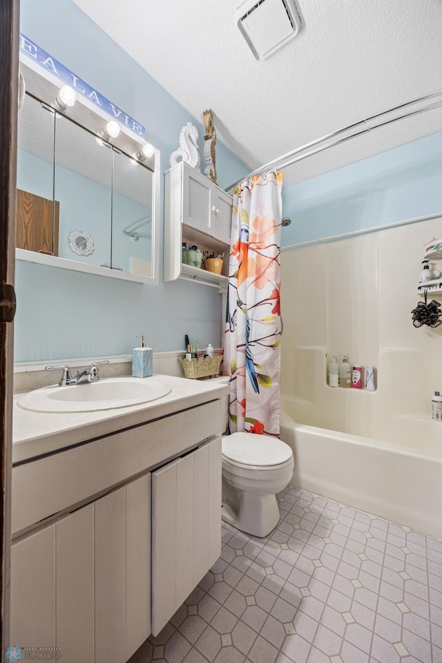 bathroom with shower / tub combo with curtain, visible vents, toilet, a textured ceiling, and vanity