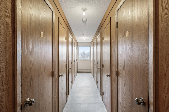 corridor with a textured ceiling