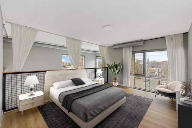 bedroom with wood finished floors