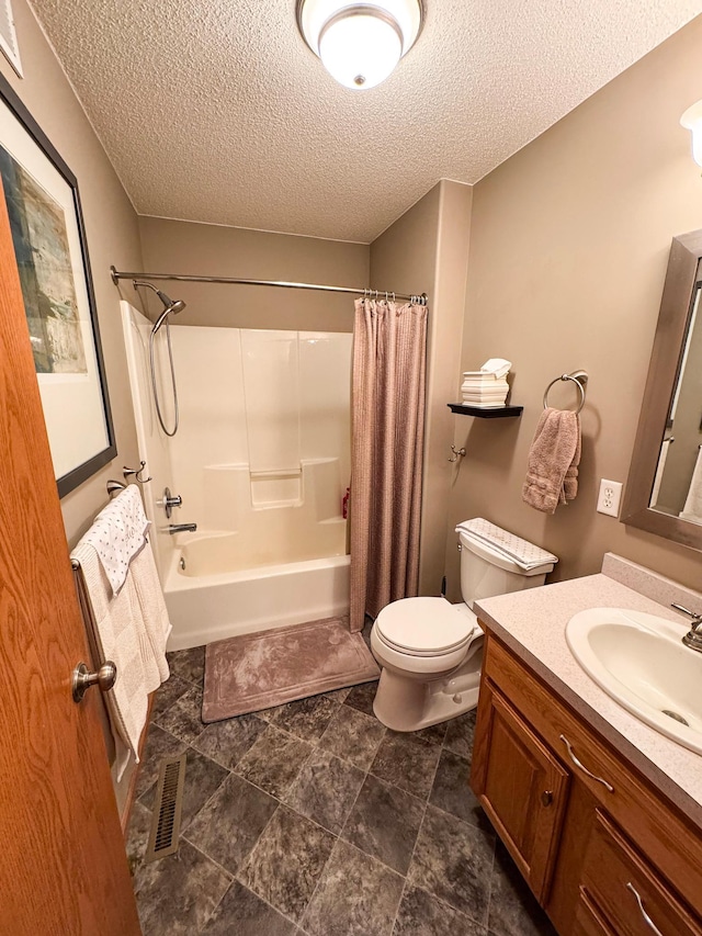 bathroom with shower / tub combo with curtain, visible vents, toilet, vanity, and a textured ceiling