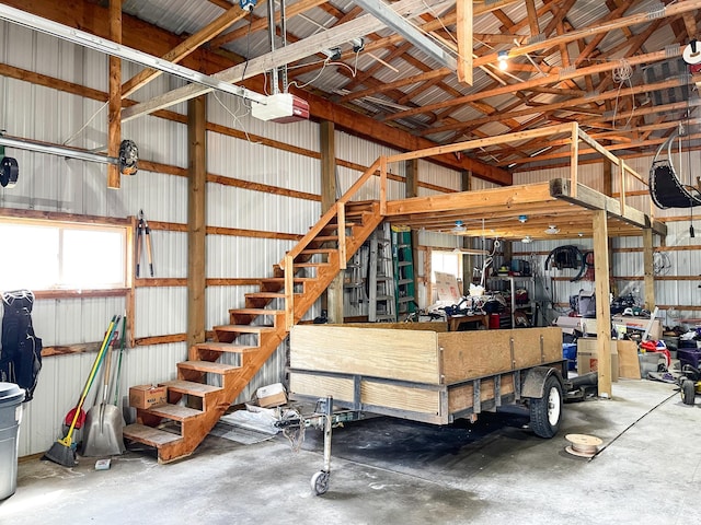 garage featuring metal wall and a garage door opener