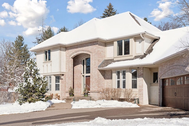 view of front of home with brick siding