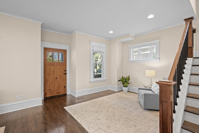 entryway featuring recessed lighting, dark wood-type flooring, baseboards, stairs, and ornamental molding