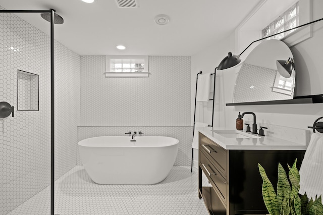 full bath featuring visible vents, tiled shower, tile patterned floors, vanity, and a freestanding tub