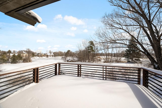 view of snow covered deck