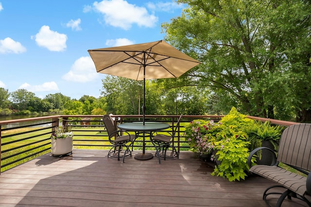 wooden terrace with a yard