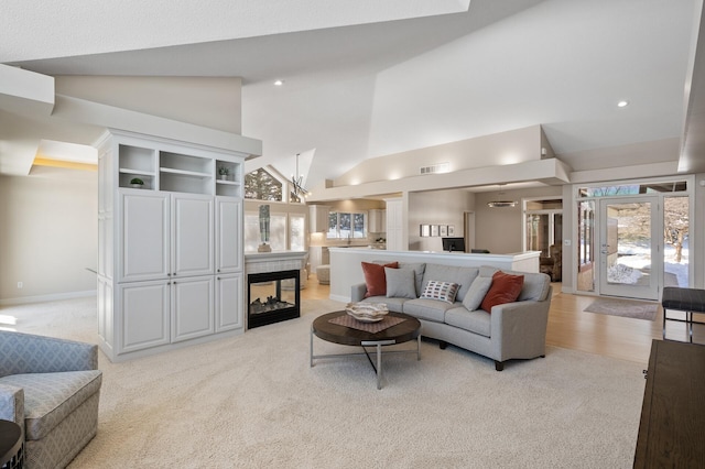 living area with high vaulted ceiling, recessed lighting, light carpet, visible vents, and baseboards