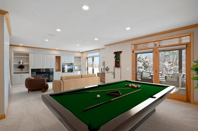 playroom with light carpet, plenty of natural light, and crown molding