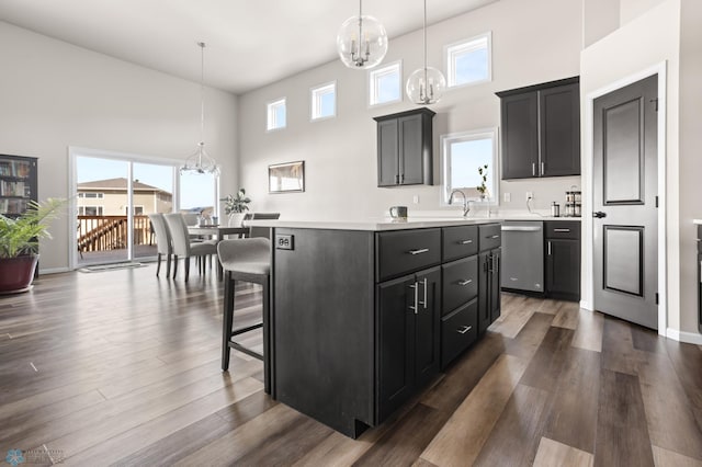 752 Cathy Dr W, West Fargo, ND 58078 - kitchen featuring an inviting chandelier, dark wood finished floors, light countertops, and dishwasher