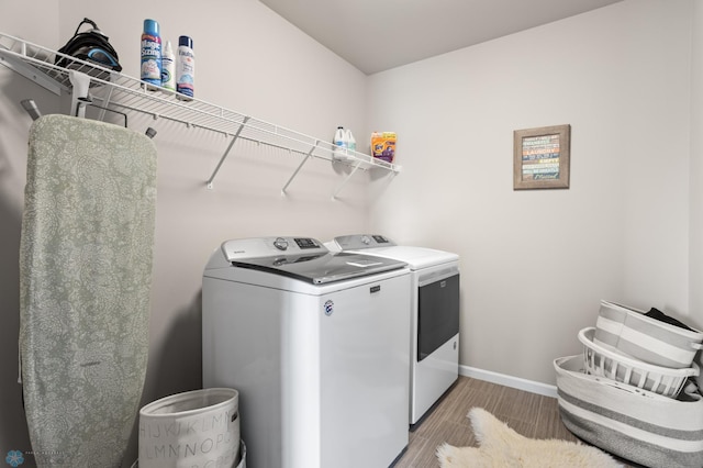 752 Cathy Dr W, West Fargo, ND 58078 - laundry room featuring laundry area, independent washer and dryer, baseboards, and wood finished floors